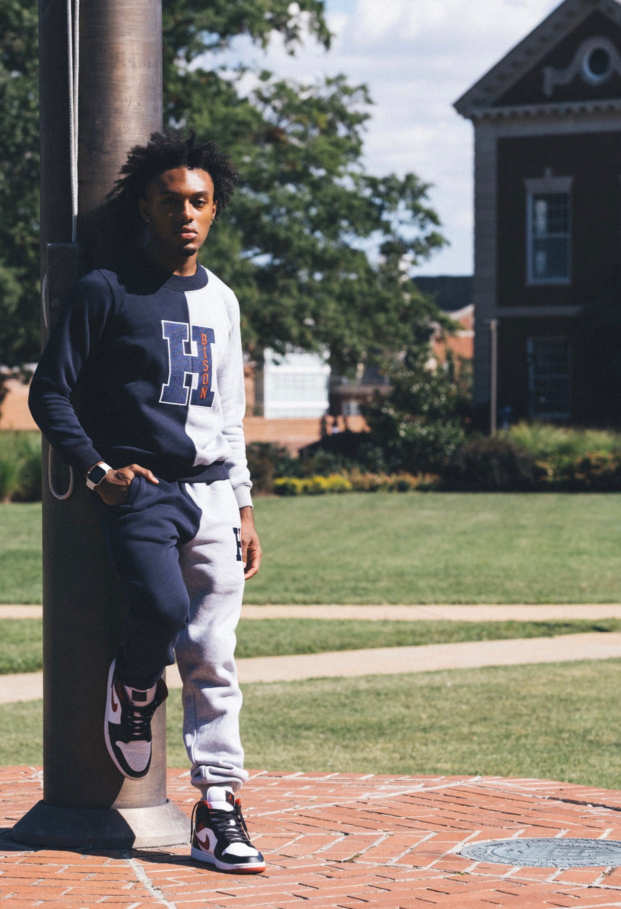 This crewneck sweatshirt and sweatpants are half blue and half gray for the Howard University Bison. It is 50% cotton and polyester. The H logo is on the front of the sweatpants and a big H logo is blue with Bison n red on the front..