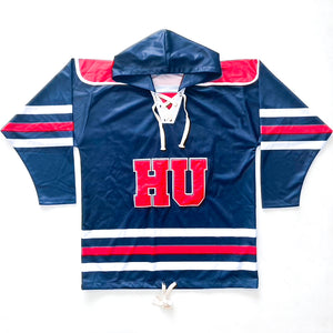 Blue, red, and white hockey jersey with a hood for the Howard University Bison. Material is 100% polyester. The front has a large HU letters.