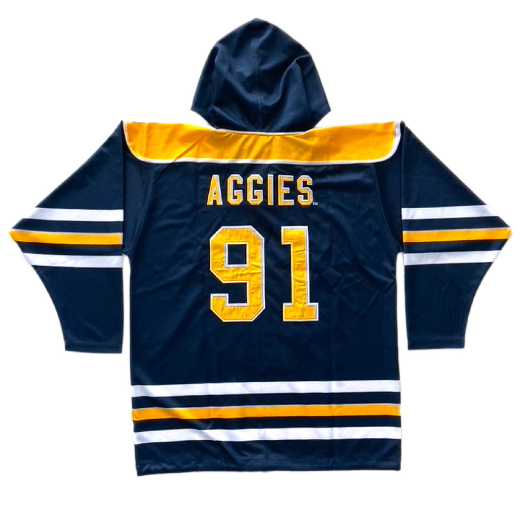 Blue, gold, and white hockey jersey with a hood for the North Carolina A&T State University Aggies. Material is 100% polyester. The back has the AGGIES logo and numbers 91.